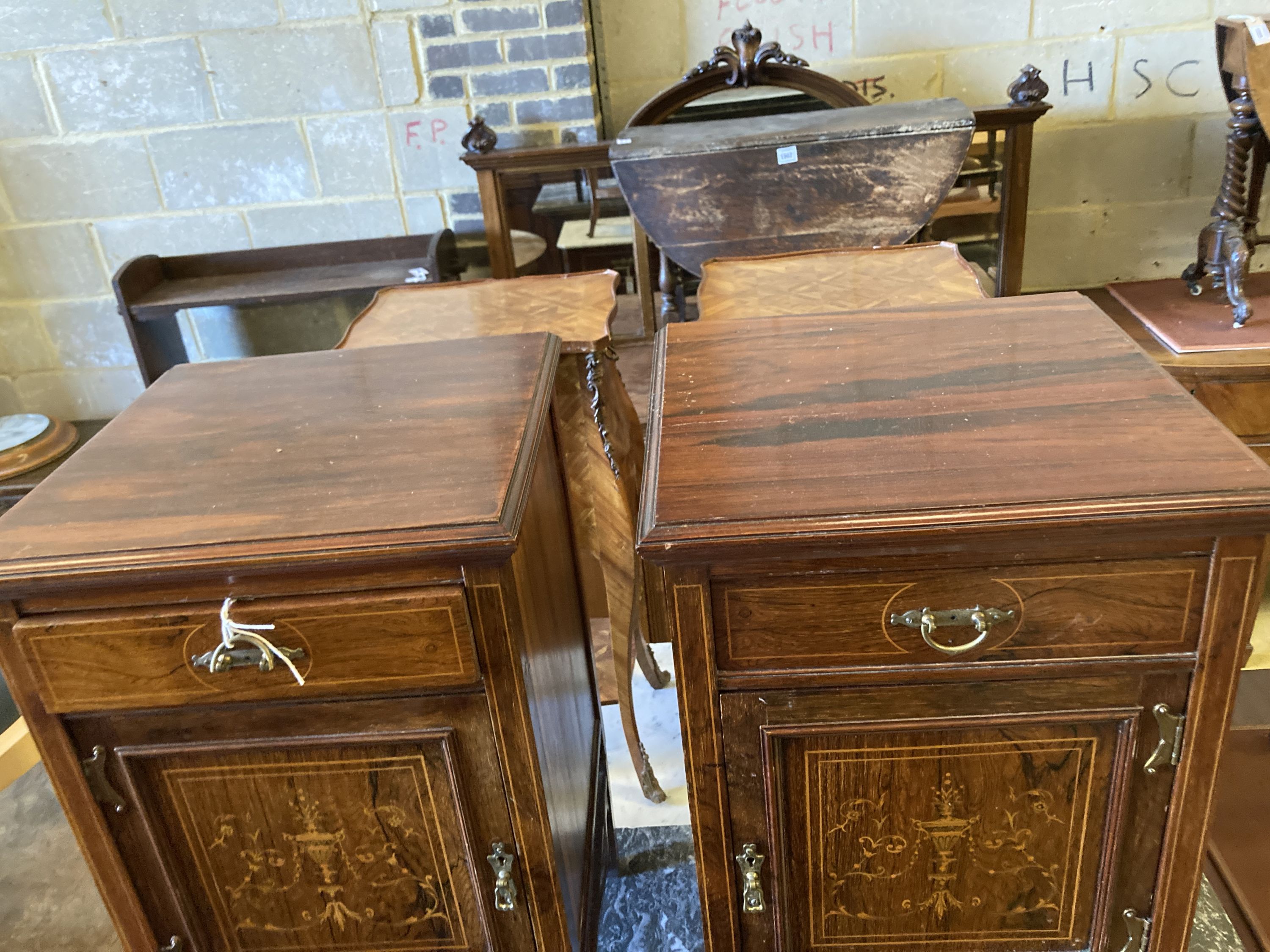 A pair of Edwardian marquetry inlaid rosewood bedside cupboards, width 39cm, depth 38cm, height 69cm